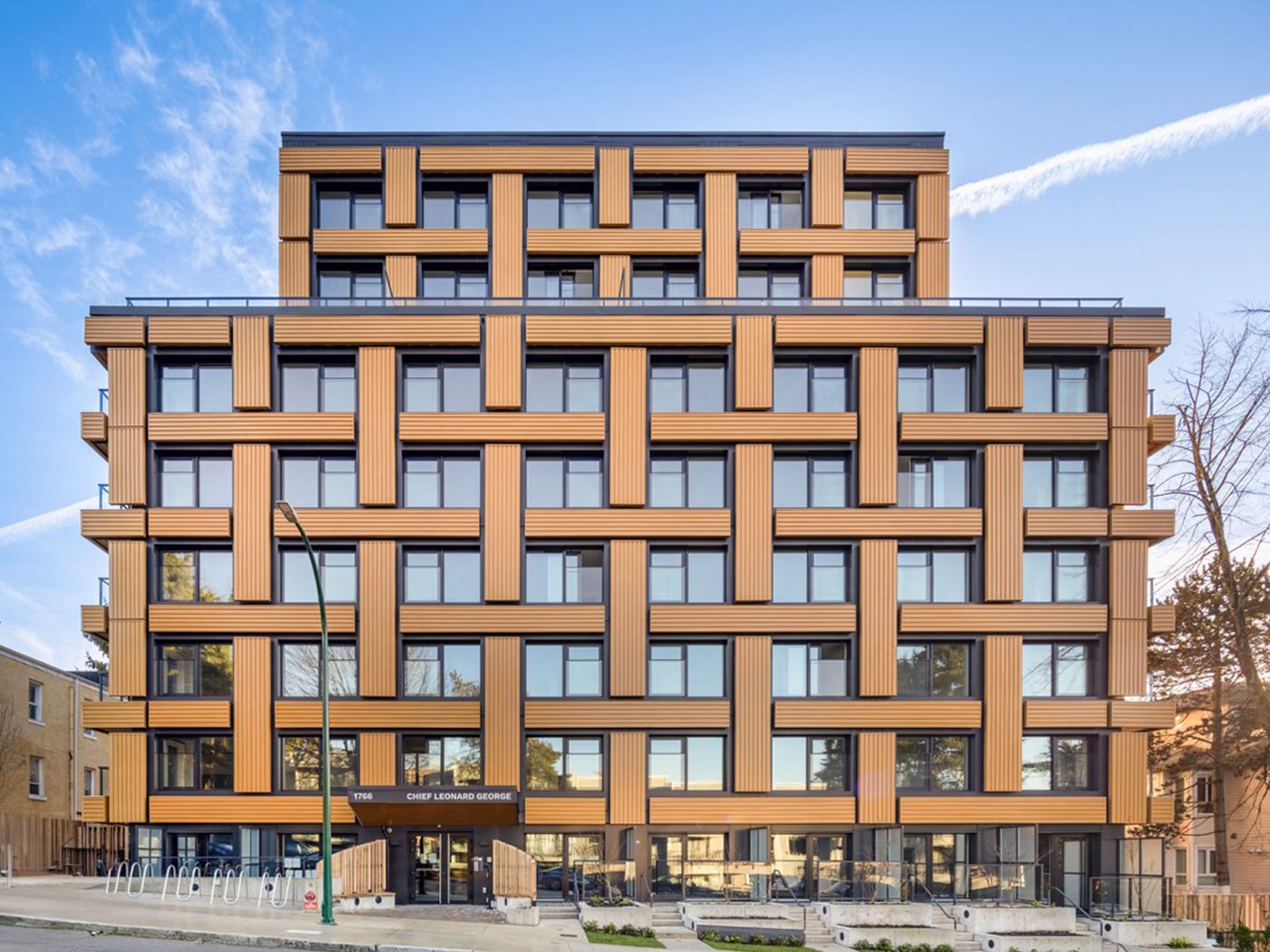 Chief Leonard George Building, with a woven pattern of timber-look facade panels